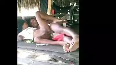 Young couple enjoy outdoor sex in a tent house on the beach