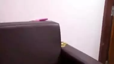 Indian MILF covers her saggy tits with pink bra in quick porn clip