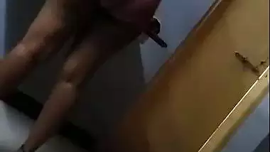 Hot figure standing topless in front of mirror