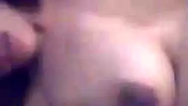 Young gal in red lingerie teases her XXX Desi pussy for the camera