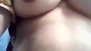 Desi fatty poses for the camera to reveal her big XXX boobs and slit