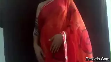 Hot & Sexy desi wife Simran Bhabhi showing boobs and ass in Red saree