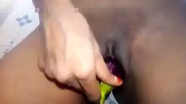 Indian girl plays XXX games on camera shoving an eggplant in her sex hole