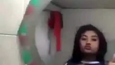 Beautiful desi girl lifting top to reveal sexy boobs